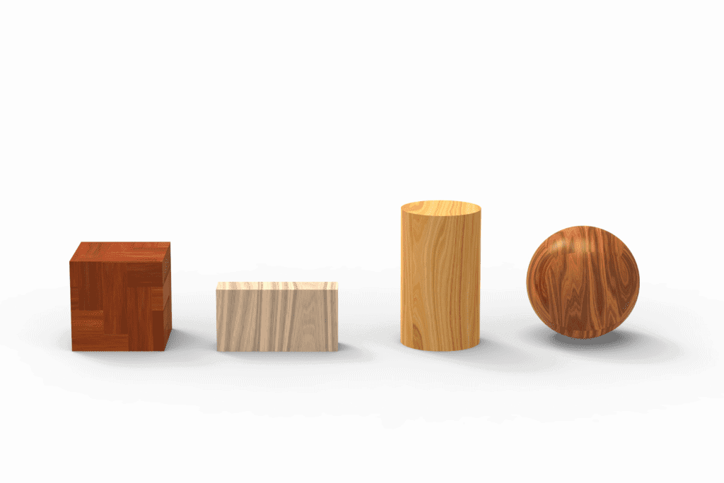A white background with 4 different shaped and different coloured wooden blocks. A sphere, tubes of different sizes and square