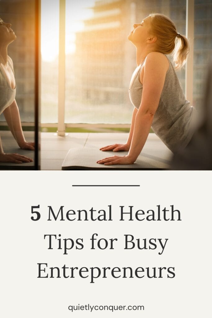 Woman in yoga pose looking in her reflection. Text reads - 5 Mental Health Tips for Busy Entrepreneurs