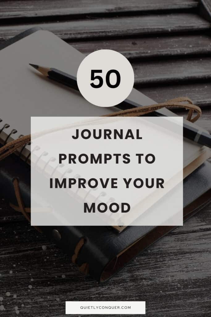 pen resting on a journal. Text in front reads. - Journal Prompts to Improve Your Mood