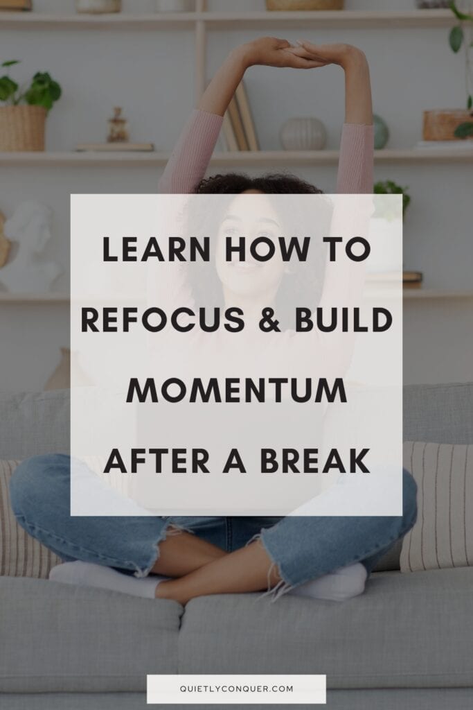 Woman at desk smiling and stretching arms above head. Text reads "Learn How to Refocus & Build Momentum After a Break"